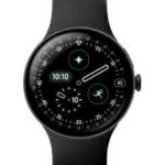 img_7347 - The Phonepreneur Global Black round smartwatch with a black band, showing the time 10:10 and multiple circular complications on a dark display.