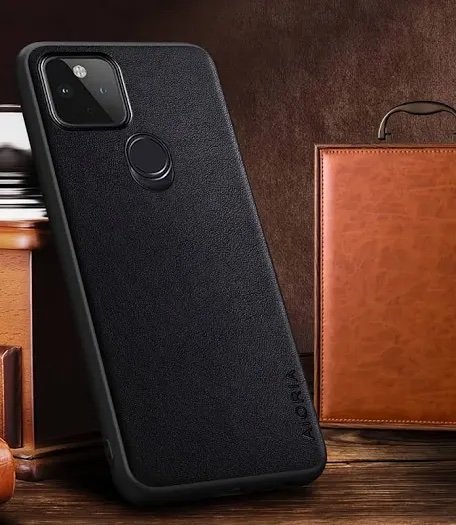 img_8289 - The Phonepreneur Global Black textured phone case with circular fingerprint sensor on the back, leaning against a wooden surface and a brown leather wallet.