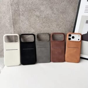 Row of five smartphone cases in white, black, gray, dark brown, and tan; the rightmost case holds a phone with a triple-camera back.