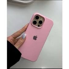 Pink iPhone in a pink protective case with a triple-camera module, held by a person with light-blue painted nails.