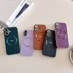 Set of five colorful phone cases with circular kickstands laid out on a light surface.
