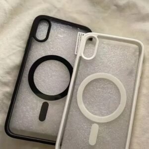 Two translucent iPhone cases with circular ring grip, one black and one white, resting on a soft fabric surface.