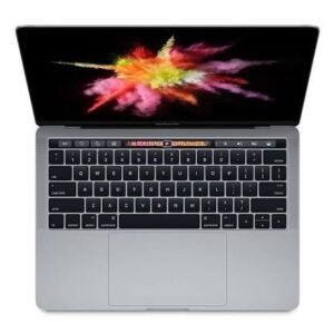 Top-down view of a silver laptop with a colorful splash wallpaper on the screen and a dark keyboard below it.