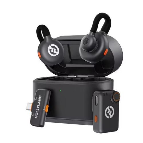 Open charging case with black wireless earbuds featuring orange accents; a USB receiver labeled HOLLYLAND sits beside the case.