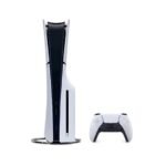 White Sony PlayStation 5 console standing vertically with its DualSense controller beside it on a white background.