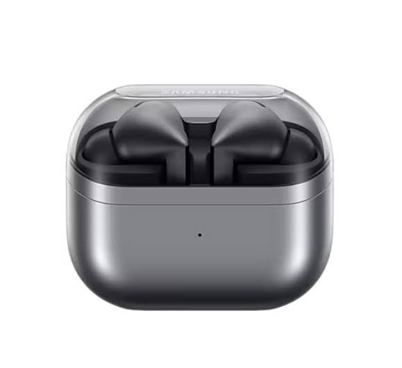 Gray wireless earbuds in an open charging case with a clear lid, resting in the compact silver case
