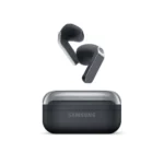 Samsung wireless earbuds with their closed charging case, shown outdoors with the buds hovering above the case.