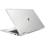 Silver HP laptop partially open on a white background, showing the keyboard and side ports.