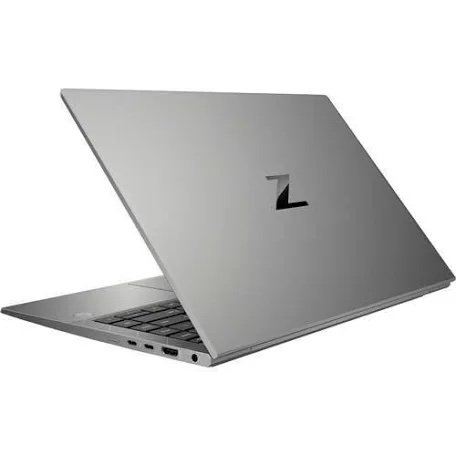 Slim silver laptop open at a slight angle, showing the keyboard and a dark logo on the lid.