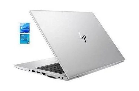 Silver laptop partially open at an angle, with an Intel Core i5 sticker floating to the left.