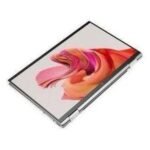 Slim silver 2-in-1 laptop/tablet at an angle, showing a vivid pink‑orange abstract wallpaper on the screen.